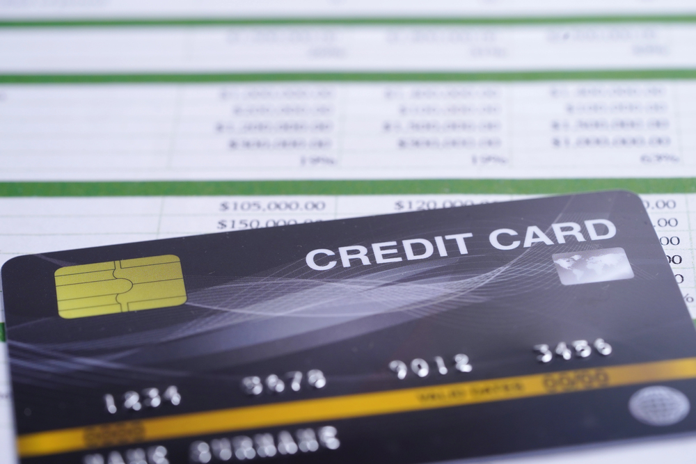 Credit cards and statement on the desk of a Chapter 7 bankruptcy attorney